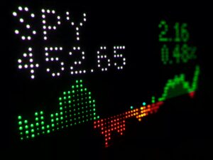 a close up of a clock with different colored numbers